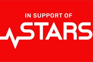 White text that reads IN SUPPORT OF and the STARS logo sit on top of a red background.