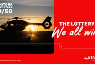 A designed graphic showing a STARS pilot and air ambulance helicopter silhouetted against a rising sun, atop a red background with a headline that reads THE LOTTERY WE ALL WIN. The STARS Lottery logo resides in the lower right corner, MANITOBA LUCKY STARS 50/50 in the upper left corner and lottery licence info in the bottom left.