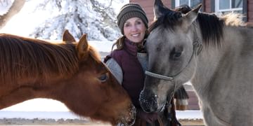 STARS Very Important Patient Paula Johnson poses alongside two of her horses at her property in winter time.