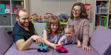 STARS Very Important Patient Shalyn Huehn pictured with her husband and children in the kids playroom at their home.