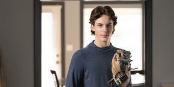 STARS Very Important Patient Zacha MacDonald wears his baseball glove in his living room.