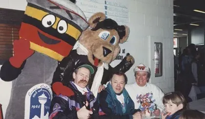 The original STARS mascot Starbear poses alongside a Calgary Tower mascot along with Calgary luminaries Lanny MacDonald, broadcaster Darrel Janz and entertainer Buck Shot.