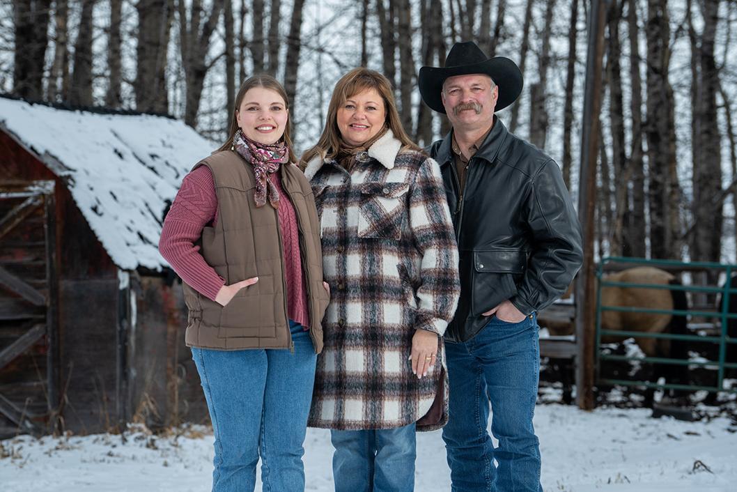 STARS Very Important Patients Kaycee and Esther Stern pose along their father and husband Wade on their property. This photo was one of a series taken for the 2025 STARS Calendar.