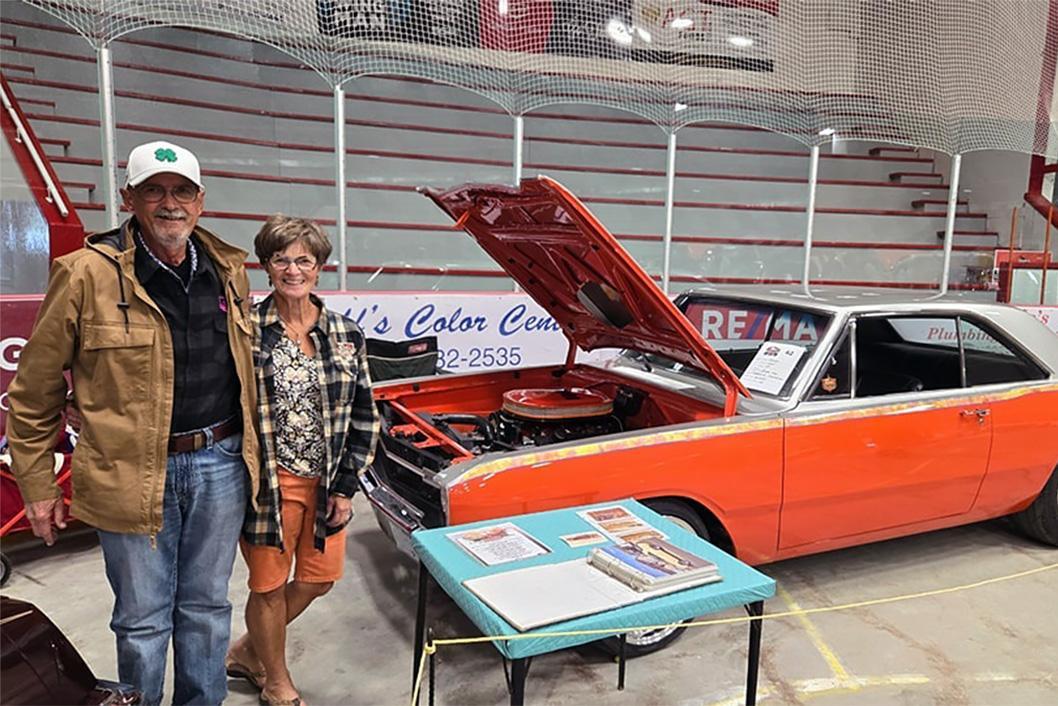 STARS Allies Ed and Patti Haraldson stand alongside a 1969 Dodge Dart they auctioned off. Proceeds from the auction were donated to STARS.