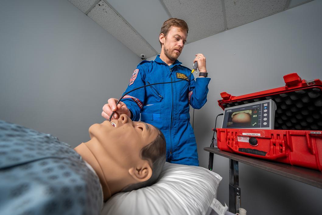 STARS transport physician Dr. Reid Hosford demonstrates the use of a new flexible bronchoscope device at the STARS Calgary base.