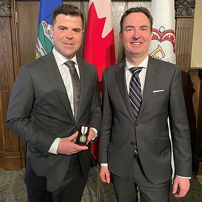 A photo of STARS Director of Flight Operations Jason Arthur receiving the Queen Elizabeth II Platinum Jubilee Medal
