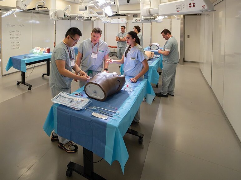 STARS transport physicians work together on a patient simulator during the first STARS Transport Physician's Conference