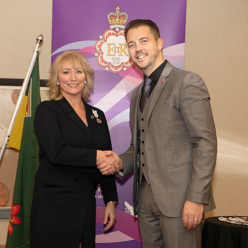 A photo of STARS Chief Fundraising and Brand Officer Terri Harris-Strunk receiving the Queen Elizabeth II Platinum Jubilee Medal