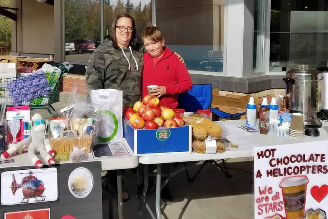 STARS Allies Jayden Sorsdahl and his mom Melanie pose at a community fundraiser they hold raising funds for STARS. Jayden is also a STARS Very Important Patient.