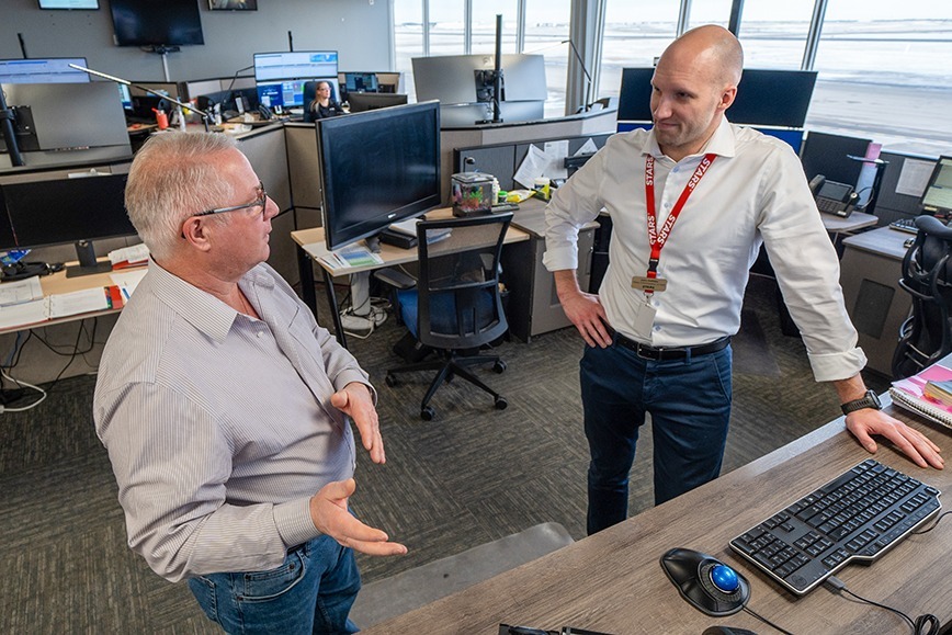 STARS VIP Rory Stewart talks with STARS Emergency Link Centre Director John Griffiths in the STARS Emergency Link Centre